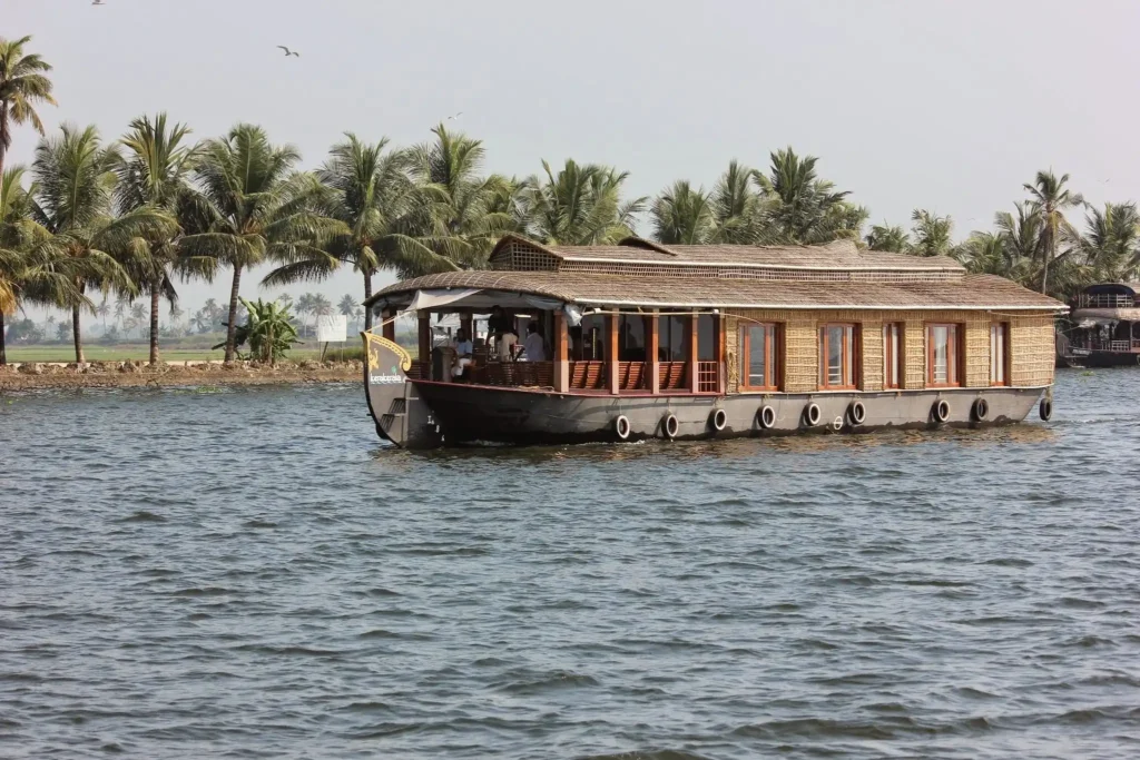 Luxury houseboat cruising through Alleppey backwaters