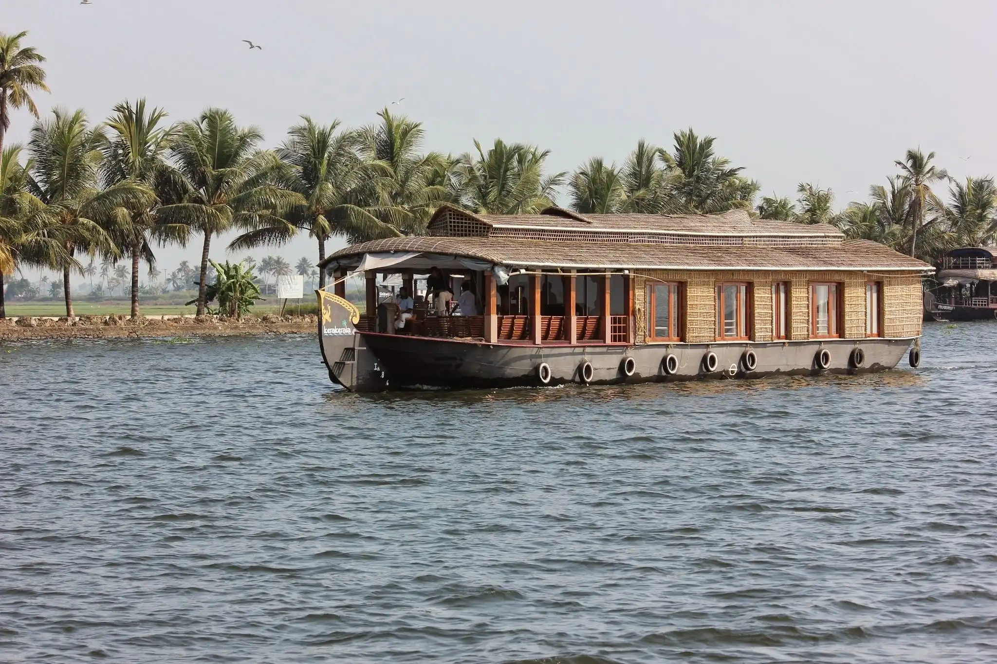 Luxury houseboat cruising through Alleppey backwaters